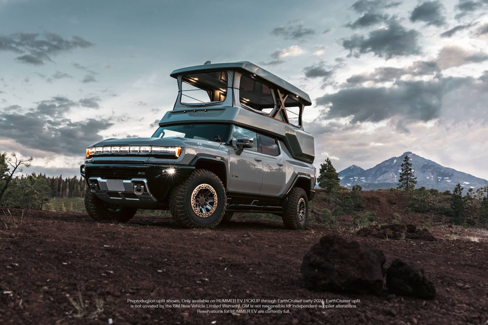 The GMC HUMMER EV EarthCruiser front diagonal angle with roof up